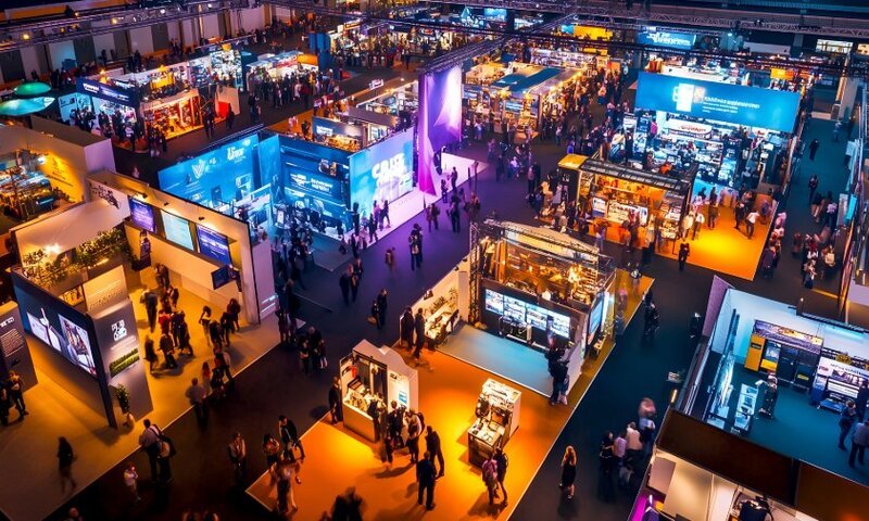 Trade show exhibition floor with branded booths and displays